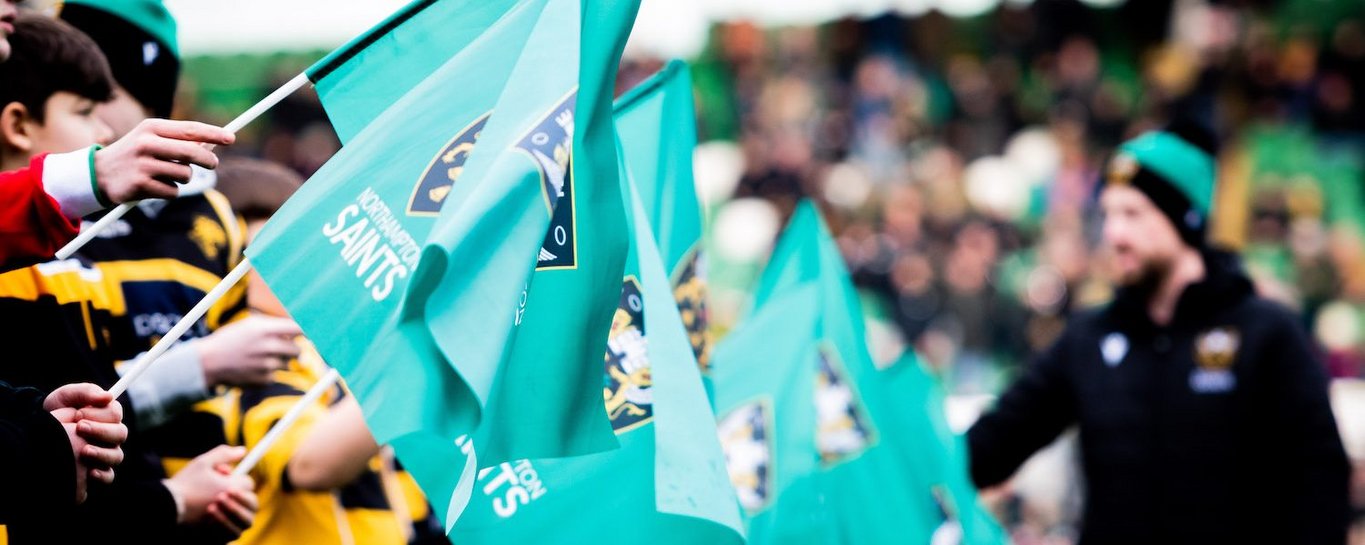 Supporters wave flags at Franklin’s Gardens