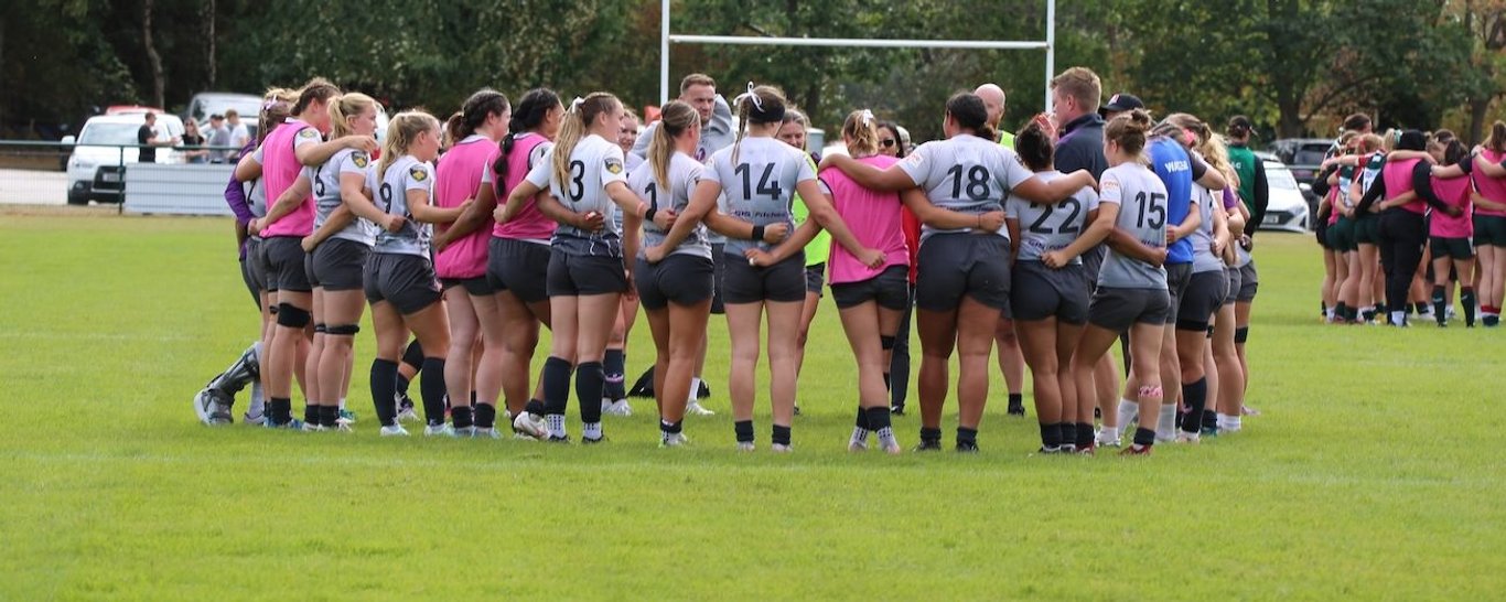 Loughborough Lightning huddle up after defeating Leicester Tigers.
