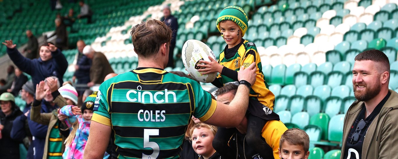 Alex Coles of Northampton Saints celebrating with supporters