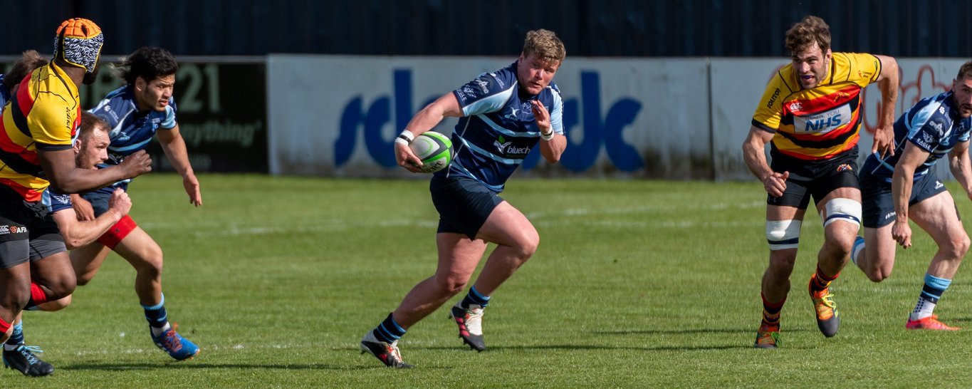 Saints' Reece Marshall sets up a try for Bedford Blues