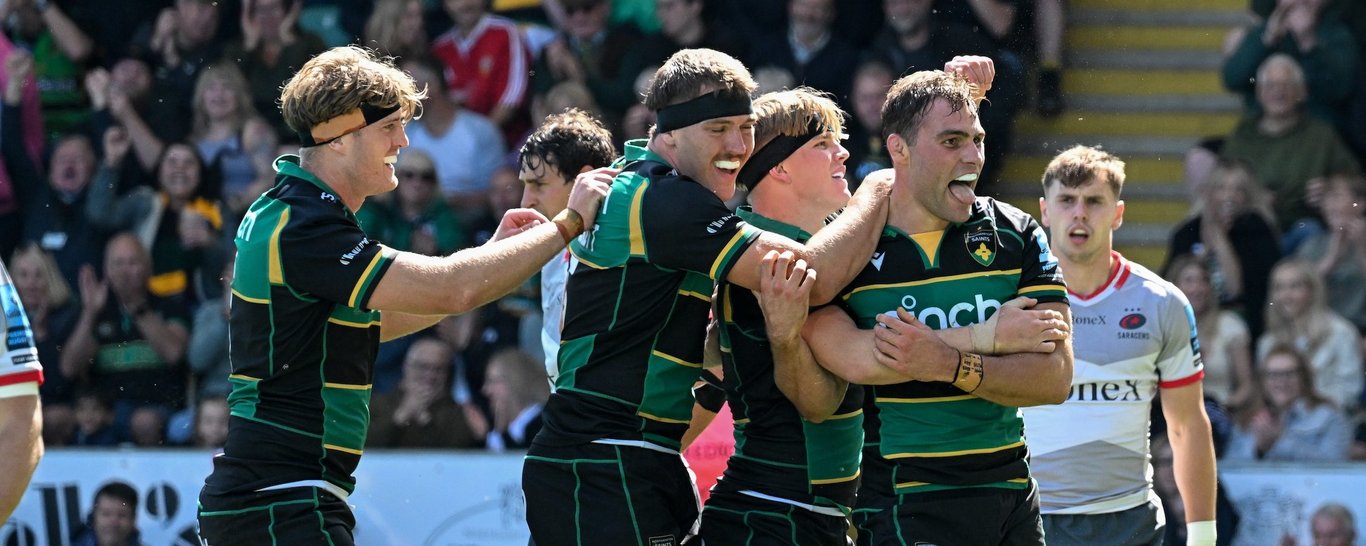 Northampton Saints celebrate scoring a try.
