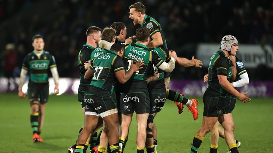 Northampton Saints celebrate a bonus-point win over Bath Rugby.