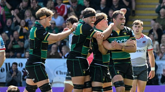 Northampton Saints celebrate scoring a try.