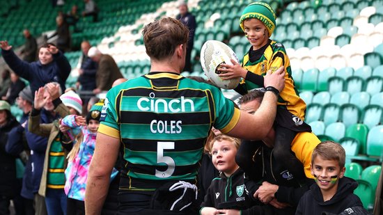 Alex Coles of Northampton Saints celebrating with supporters