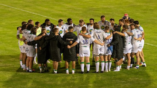 Northampton Saints’ players huddle together