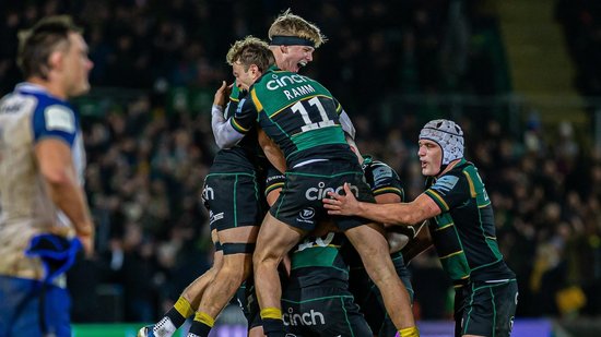 Northampton Saints celebrate scoring a try.