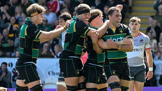 Northampton Saints celebrate scoring a try.